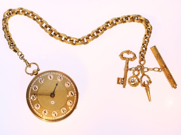 Man's pocket watch with winding key
